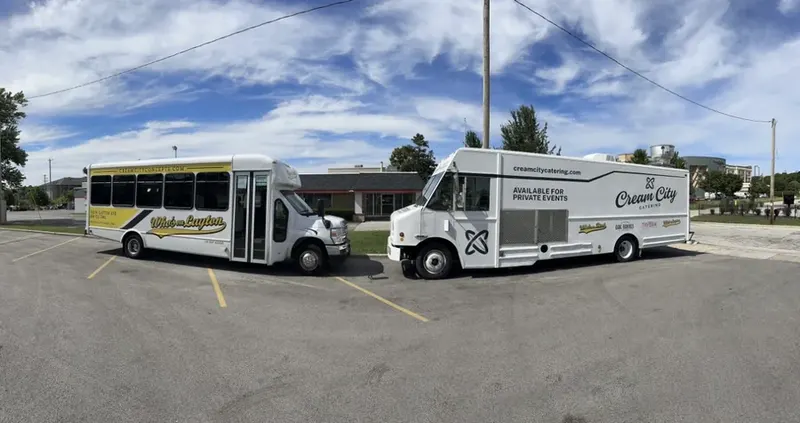 One of the shuttles parked beside the Cream City catering truck