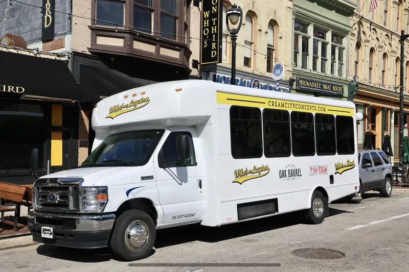 A Cream City Concepts shuttle bus parked on North Dr. Martin Luther King Jr. Drive in downtown Milwaukee outside Who's on Third